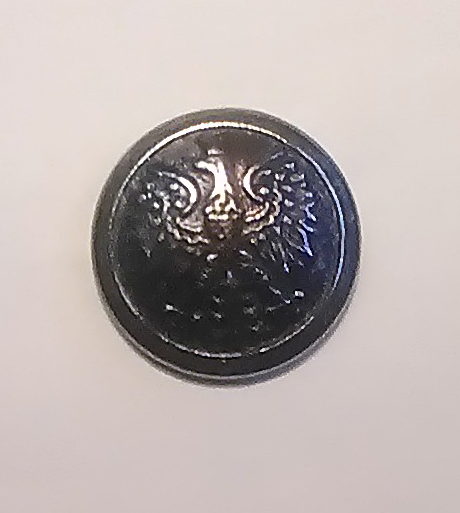 A replica of a button fund in Katyn issued by the National Center of Culture in 2007 as part of an educational campaign in cooperation with the IPN