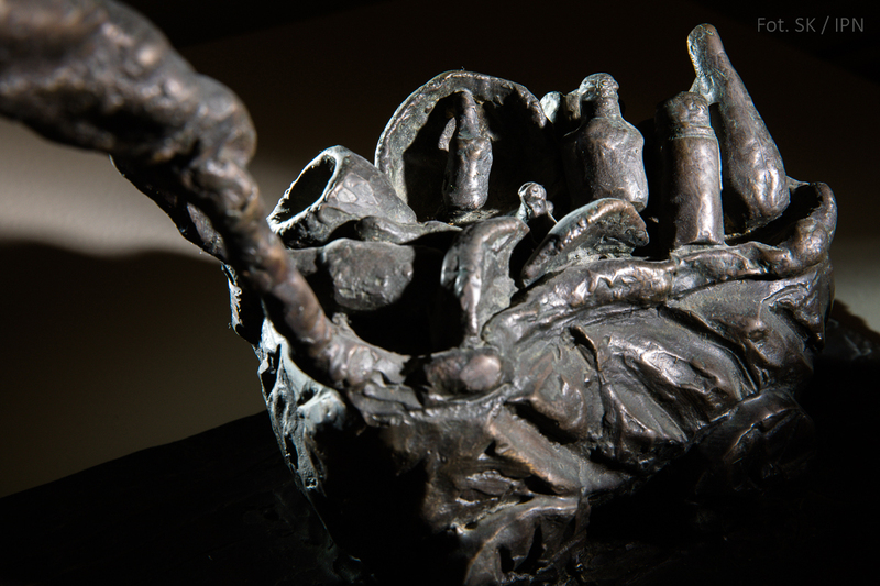 AN INMATE COLLECTING BOTTLES , BRONZE 2000